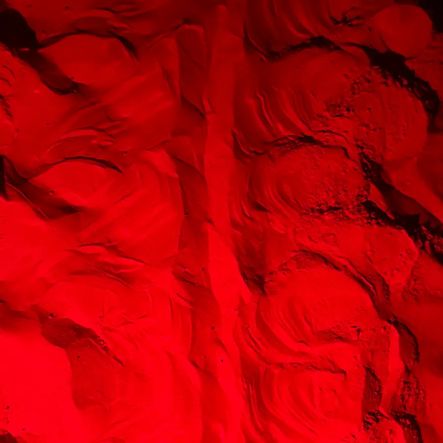 Close-up of sand at a nest site under red light